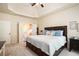 Comfortable main bedroom with ensuite bathroom and carpeted floors at 6140 Stillwood Ln, Cumming, GA 30041