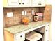 Charming office nook with granite countertops, under-cabinet storage, and a comfortable seating area at 6140 Stillwood Ln, Cumming, GA 30041