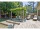 Outdoor deck with a pergola and comfortable seating area for dining and lounging at 122 Griffin Way, Canton, GA 30115