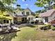 Spacious backyard featuring a large deck, patio furniture, and manicured lawn perfect for outdoor living at 122 Griffin Way, Canton, GA 30115