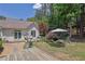 Backyard showcasing a pond, mature trees, and a peaceful seating area at 122 Griffin Way, Canton, GA 30115
