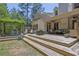Expansive backyard featuring a pergola-covered seating area, lush landscaping, and a deck at 122 Griffin Way, Canton, GA 30115