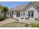 Landscaped backyard featuring a wooden deck with chairs, lush lawn, and rock garden at 122 Griffin Way, Canton, GA 30115
