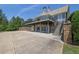 Back of house features patio with stairs and outdoor seating at 122 Griffin Way, Canton, GA 30115