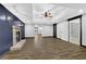 Finished basement with wood-look flooring, fireplace, recessed lighting and neutral walls at 122 Griffin Way, Canton, GA 30115