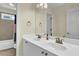 Bathroom featuring double sinks and a large mirror at 122 Griffin Way, Canton, GA 30115