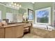 Luxurious bathroom with garden tub, dual sinks, granite counters, and tiled floor at 122 Griffin Way, Canton, GA 30115