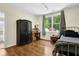 Cozy bedroom boasting natural light and hardwood floors at 122 Griffin Way, Canton, GA 30115