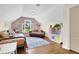 Bedroom with vaulted ceiling, light pink walls, hardwood floor, and a window view of the yard at 122 Griffin Way, Canton, GA 30115