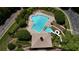 Aerial view of a community pool featuring a slide, lounge chairs, and neatly manicured landscaping at 122 Griffin Way, Canton, GA 30115