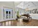 Elegant foyer featuring hardwood floors, a coffered ceiling, and a grand piano, creating a welcoming ambiance at 122 Griffin Way, Canton, GA 30115