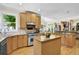 Well-lit kitchen with wood cabinets, granite countertops, stainless steel appliances, and an open layout at 122 Griffin Way, Canton, GA 30115