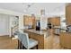 Spacious kitchen with dual islands, wood cabinets, granite countertops, and stainless steel appliances at 122 Griffin Way, Canton, GA 30115