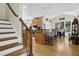 An open kitchen with bar seating, hardwood floors and stainless appliances at 122 Griffin Way, Canton, GA 30115