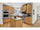 Gourmet kitchen with stainless steel appliances, granite countertops, wood floors and custom cabinets at 122 Griffin Way, Canton, GA 30115