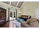 Bright living room with hardwood floors, high ceilings, access to backyard, and a comfortable seating area at 122 Griffin Way, Canton, GA 30115