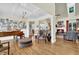Elegant living room with hardwood floors, piano, fireplace, and ample seating area at 122 Griffin Way, Canton, GA 30115