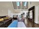 Open-concept living area with hardwood floors, vaulted ceiling, comfortable seating, and modern lighting at 122 Griffin Way, Canton, GA 30115