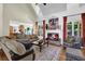 Living room with vaulted ceilings, fireplace, large windows, and comfortable seating at 122 Griffin Way, Canton, GA 30115