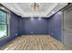 Stylish room with laminate floors, recessed lighting, and a large window offering natural light at 122 Griffin Way, Canton, GA 30115