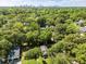 Aerial view of a neighborhood with mature trees and the city skyline in the distance at 166 Martha Ave, Atlanta, GA 30317