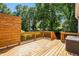 Spacious wooden back deck with a modern privacy screen perfect for outdoor entertaining and relaxation at 166 Martha Ave, Atlanta, GA 30317