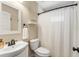 Neutral bathroom with a shower/tub, modern vanity, and a decorative shelf, designed for both style and functionality at 166 Martha Ave, Atlanta, GA 30317