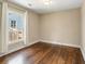 Bright bedroom featuring hardwood floors, a window for natural light, and clean design for flexible use at 166 Martha Ave, Atlanta, GA 30317