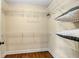 Walk-in closet with wire shelving for maximum storage and hardwood floors at 166 Martha Ave, Atlanta, GA 30317
