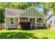 Charming craftsman home with welcoming front porch, manicured lawn and mature landscaping at 166 Martha Ave, Atlanta, GA 30317