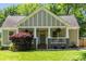 Charming craftsman-style home with well-manicured lawn and inviting front porch at 166 Martha Ave, Atlanta, GA 30317