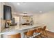 Bright eat-in kitchen featuring a granite countertop island and stainless steel appliances at 166 Martha Ave, Atlanta, GA 30317
