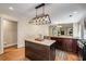 Kitchen with granite island countertop, stainless appliances and view of eat-in and front entry at 166 Martha Ave, Atlanta, GA 30317