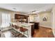 Bright eat-in kitchen featuring a granite countertop island with barstool seating and stainless appliances at 166 Martha Ave, Atlanta, GA 30317
