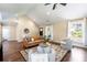 Cozy living room with hardwood floors, vaulted ceiling and ample natural light at 166 Martha Ave, Atlanta, GA 30317