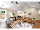 Comfortable living room featuring a vaulted ceiling, stylish furniture and hardwood floors at 166 Martha Ave, Atlanta, GA 30317