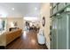 Inviting living room with hardwood floors that flows to the dining and kitchen area at 166 Martha Ave, Atlanta, GA 30317