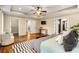 Spacious main bedroom with tray ceilings, hardwood floors, and access to closets and ensuite at 166 Martha Ave, Atlanta, GA 30317