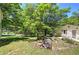 Landscaped backyard with rocks and a view of the home's exterior at 191 White Oak Church Rd, Dallas, GA 30157