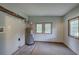 Basement utility area featuring a water heater, carpet, and a window at 191 White Oak Church Rd, Dallas, GA 30157