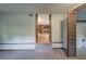 Finished basement area with carpet and bi-fold doors leading to other rooms at 191 White Oak Church Rd, Dallas, GA 30157