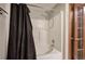 Bathroom featuring a bathtub and shower behind a black curtain at 191 White Oak Church Rd, Dallas, GA 30157