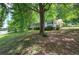 Charming home nestled amongst mature trees with a covered front porch at 191 White Oak Church Rd, Dallas, GA 30157