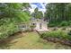 Charming single-story home with a manicured front yard and surrounded by mature trees at 191 White Oak Church Rd, Dallas, GA 30157