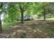 Quaint home on a lush lot with mature trees and a covered front porch at 191 White Oak Church Rd, Dallas, GA 30157