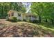 Scenic exterior view featuring a long porch and green surroundings, exuding a tranquil atmosphere at 191 White Oak Church Rd, Dallas, GA 30157