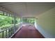 Spacious covered porch with a porch swing, perfect for enjoying the outdoors at 191 White Oak Church Rd, Dallas, GA 30157
