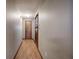 Hallway with laminate flooring and doors leading to different rooms at 191 White Oak Church Rd, Dallas, GA 30157