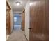 Hallway view with carpet, light walls, and wood trim leading to various rooms at 191 White Oak Church Rd, Dallas, GA 30157