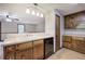 Classic kitchen featuring wood cabinets and a view to the connecting living room at 191 White Oak Church Rd, Dallas, GA 30157